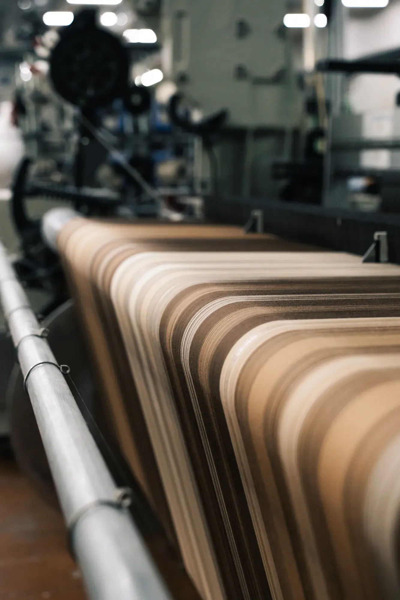 Freshly woven fabric on the looms at the RIFER mill