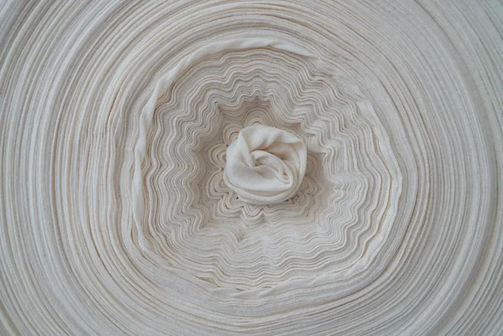 Raw natural fibre coil
